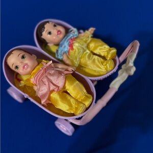 Disney Tolly Tots 5" baby dolls with a double stroller. 
Snow White and Belle
